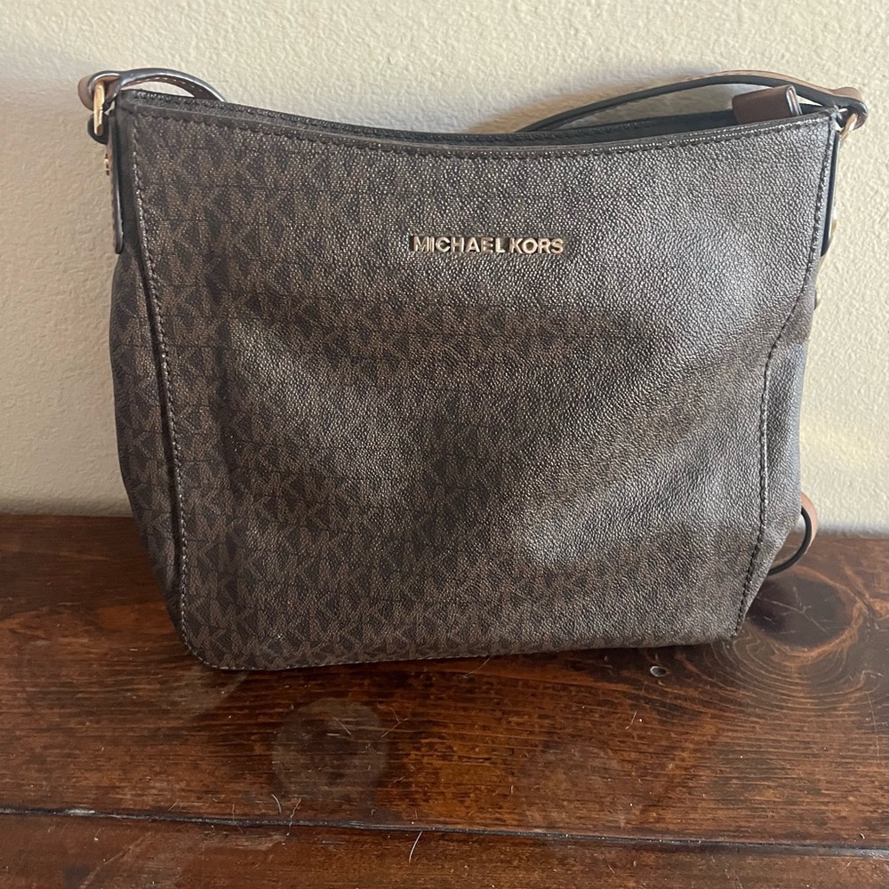 Michael Kors purse. Brown, small signature logo. 9 x 10. Good condition.